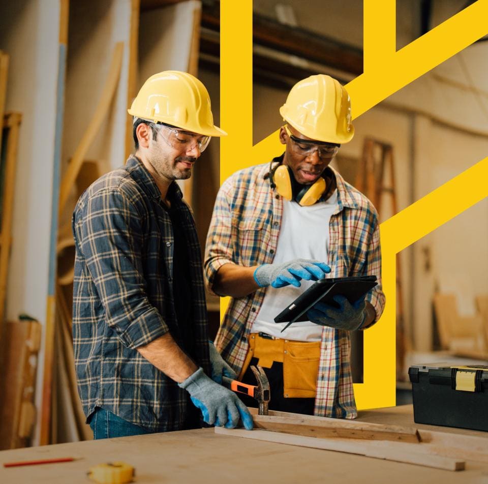 Construction professionals reviewing plans on site